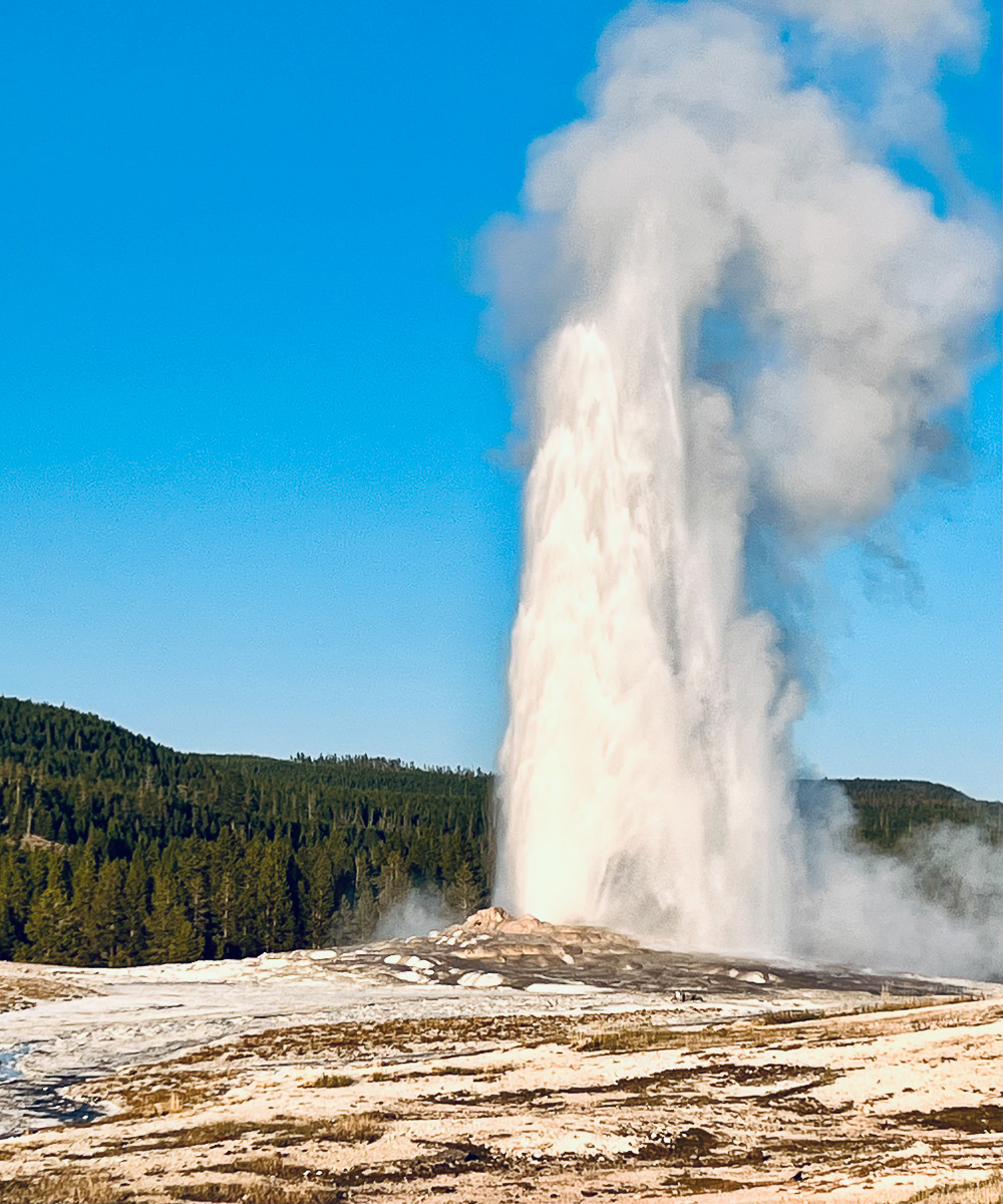 Old Faithful erupting at Yellowstone National Park